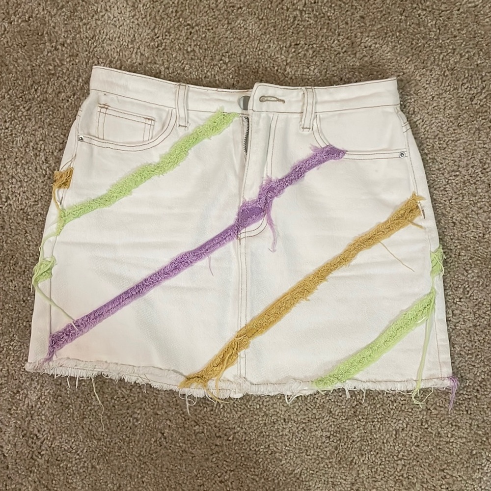 White denim skirt with pops of color